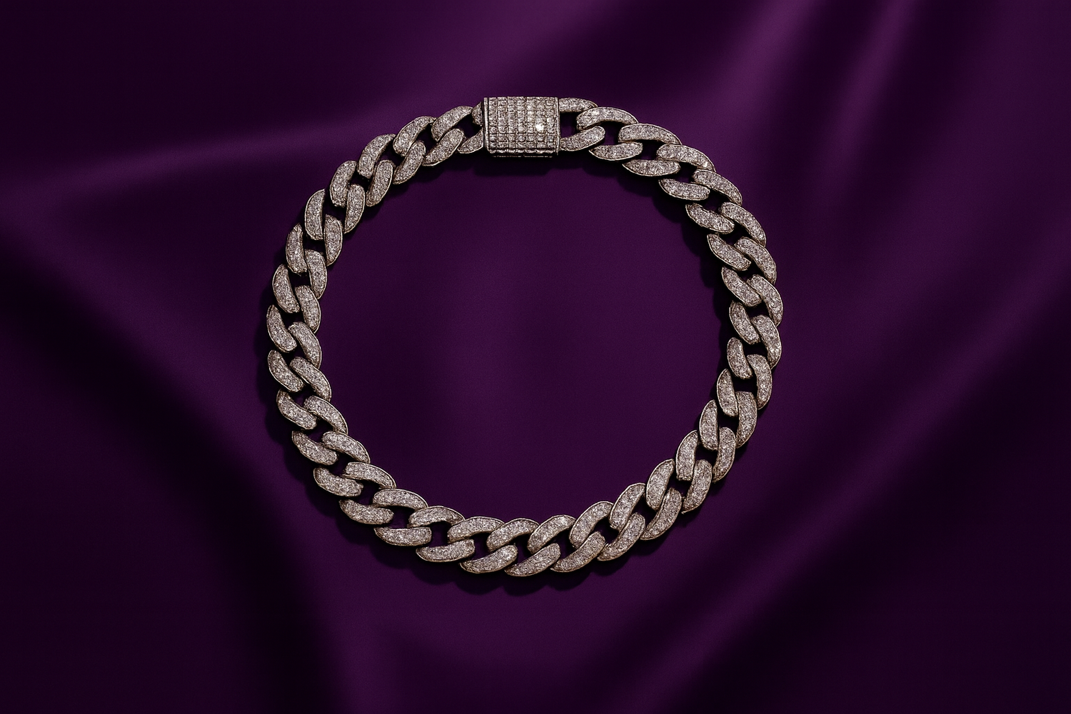Silver chain bracelet on a purple fabric background